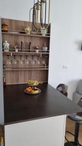 a black counter top with a plate of food on it at Evergreen House - Japartments in Genova +17 photos