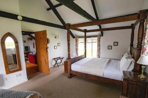 Voodi või voodid majutusasutuse Bligh - Treworgie Barton Cottages toas