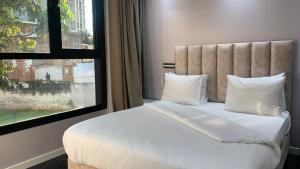 Ένα ή περισσότερα κρεβάτια σε δωμάτιο στο Premium apart with rooftop pool