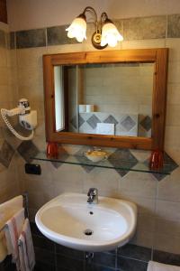 a bathroom with a sink and a mirror at Hotel Tersiva in Valtournenche