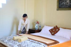 Postel nebo postele na pokoji v ubytování The Reinhold Guesthouse Bali