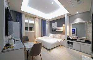 Seosan Hound Hotel客房内的一张或多张床位