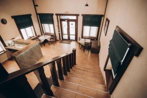 a view of a staircase in a living room with furniture at Хостел 24 in Khmelnytskyi