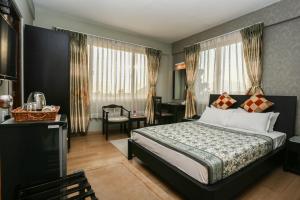 Llit o llits en una habitació de Nirvana Home
