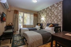 Llit o llits en una habitació de Nirvana Home