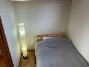 Postel nebo postele na pokoji v ubytování GuestHouse　YOU&I