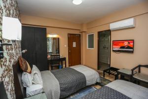 Llit o llits en una habitació de Nirvana Home