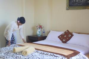 Postel nebo postele na pokoji v ubytování The Reinhold Guesthouse Bali