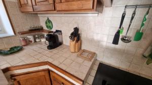 an overhead view of a kitchen counter with utensils at Wildflowers House - JApartments in Genova