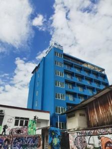 a blue building with graffiti on the side of it at Chevasai Huahin Hotel in Hua Hin