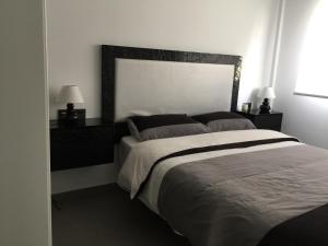 Postel nebo postele na pokoji v ubytování Apartment OasisBeach La Zenia