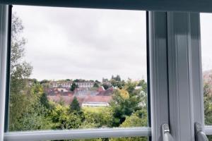 a window with a view of a city at Fabulous 2bedroom flat in Coventry