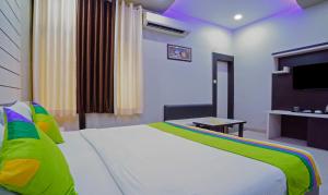 Hotel Raj Garden客房内的一张或多张床位