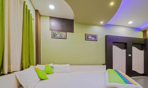 Hotel Raj Garden客房内的一张或多张床位