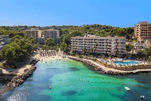 an aerial view of a beach with people in the water at BelleVue Cala Vinyes in Cala Vinyes