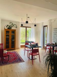 a dining room with tables and chairs in a room at Countryhouse Verso in Rovereto