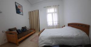 Кровать или кровати в номере Appartement centre ville Oran