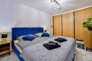 Posteľ alebo postele v izbe v ubytovaní Nowoczesne Apartamenty typu Superior - Bulwary Rabka Zdrój - Balia - Blisko Park Zdrojowy