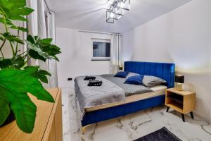 Posteľ alebo postele v izbe v ubytovaní Nowoczesne Apartamenty typu Superior - Bulwary Rabka Zdrój - Balia - Blisko Park Zdrojowy