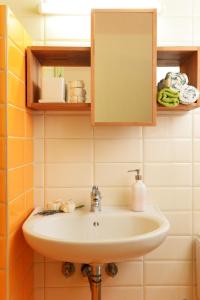 a bathroom with a sink and a mirror at Esperides in Marathopoli