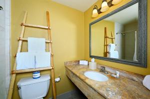 a bathroom with a sink and a mirror and a toilet at Hotel Glorieta in Santa Fe +53 photos