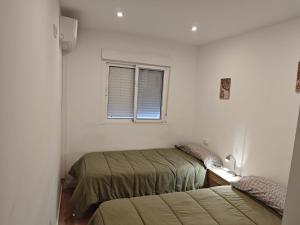 Un pat sau paturi într-o cameră la La Casita - Acogedora casita rural con piscina independiente +17 fotografii