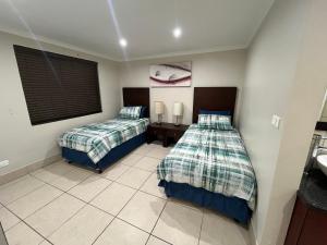 En eller flere senge i et værelse på Nautica 108