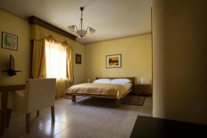 a bedroom with a bed and a window at Vibo In Centro in Vibo Valentia