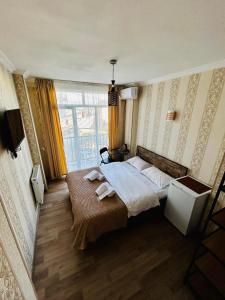 Postel nebo postele na pokoji v ubytování Hotel Marioni
