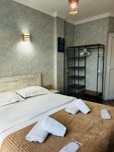 Postel nebo postele na pokoji v ubytování Hotel Marioni