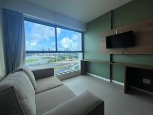 Μια τηλεόραση ή/και κέντρο ψυχαγωγίας στο Flat de Luxo no Parque do Cais