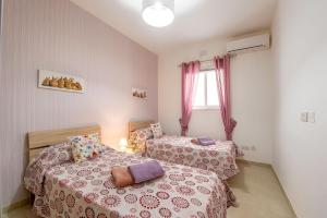 Letto o letti in una camera di Hillock Residence Apartments