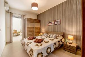 Letto o letti in una camera di Hillock Residence Apartments