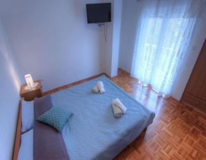 Posteľ alebo postele v izbe v ubytovaní Apartments Miljenko