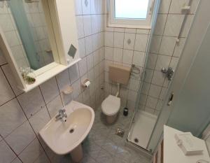 Kúpeľňa v ubytovaní Apartments Miljenko