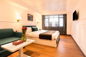 Postel nebo postele na pokoji v ubytování Summit Mall Stone Hotel
