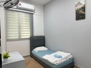 Krevet ili kreveti u jedinici u okviru objekta Seremban Pool View 5-6 pax Suite