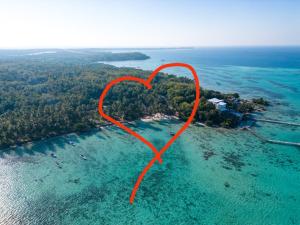 a red heart in the water next to a island at Eco Casa in Karimunjawa