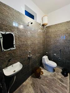 a bathroom with a toilet and a bidet and a sink at Suri Guest House in Pushkar +38 photos
