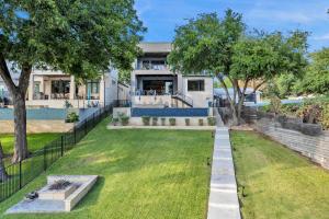 an image of a house with a yard at Lakeshore Retreat with Concierge Services in Kingsland