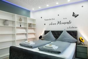 Кровать или кровати в номере Modern Apartments Neuburg 1 - New