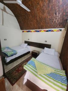 A bed or beds in a room at Dara guest House