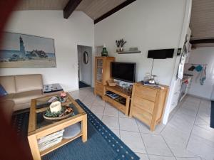 Posezení v ubytování Ferienhaus MEERZeit + 26 fotografií