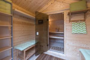 a sauna in a wooden cabin with a window at Landhaus Blauer Spatz Reichenau an der Rax in Reichenau
