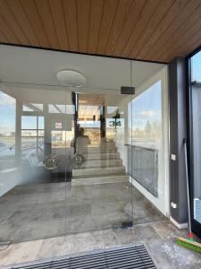 a glass entrance to a building with a staircase at ENSAS rooms in Koblenz