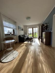 a living room with a couch and a table at Ferienwohnung Kastanienhof in Hasselberg