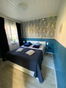 Postel nebo postele na pokoji v ubytování Snöå Bruk Hotell och konferens