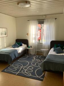 Postel nebo postele na pokoji v ubytování Snöå Bruk Hotell och konferens
