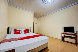 Et tv og/eller underholdning på OYO 93422 Villa Tirto