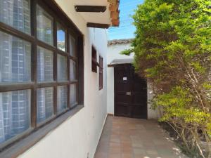 a doorway to a house with a door and windows at Apartamento ALTAMIRA de la VILLA de Leyva in Villa de Leyva +23 photos